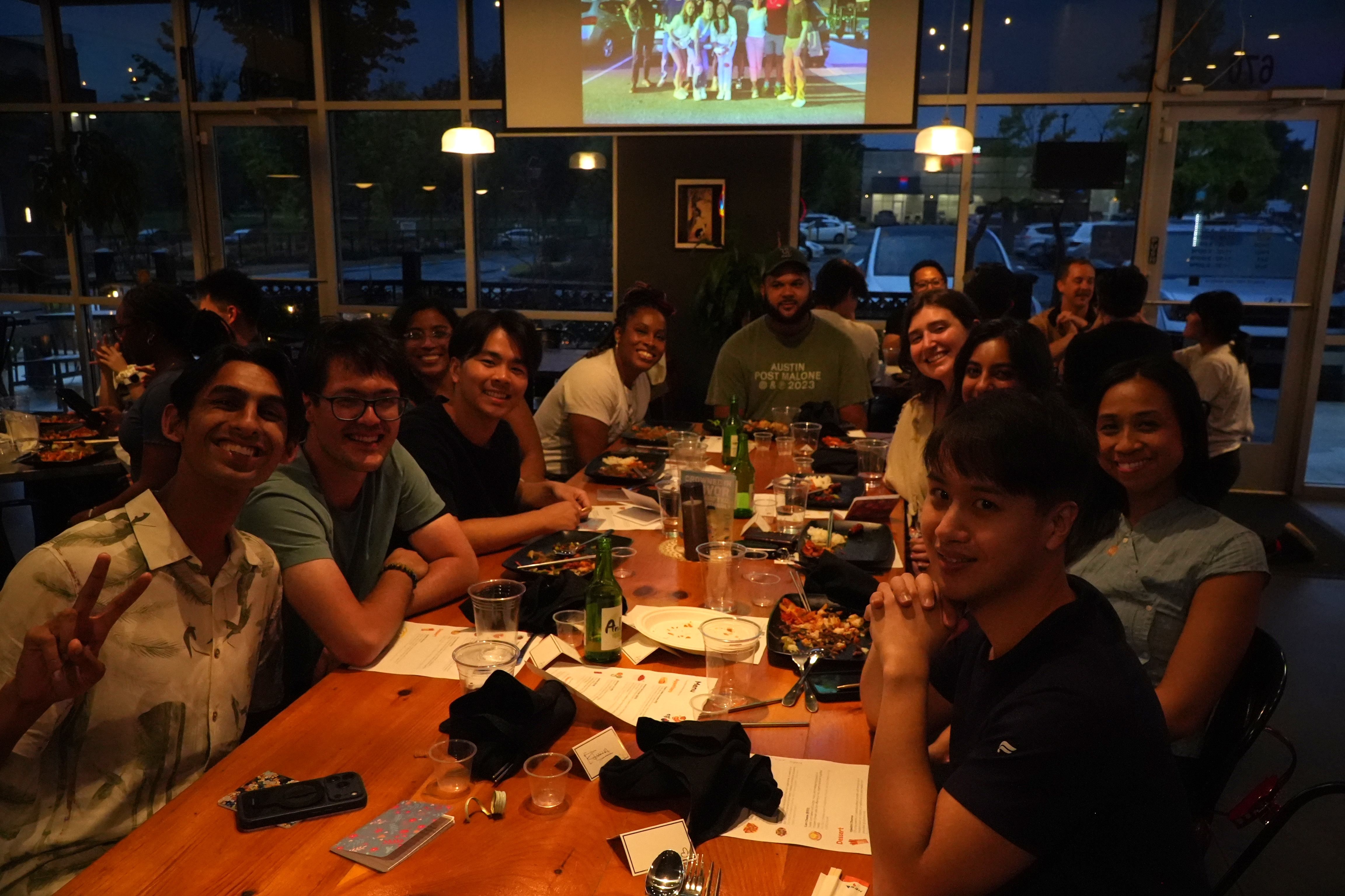 Tiger Club members around a long dinner table