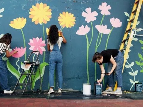 Tiger Club members painting a mural together